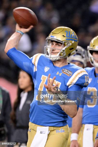 Quarterback Matt Lynch of the UCLA Bruins throws the football prior to the Cactus Bowl against Kansas State Wildcats at Chase Field on December 26,...