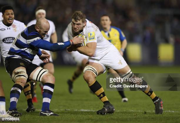 Joe Launchbury of Wasps is stopped by Matt Garvey during the Aviva Premiership match between Bath Rugby and Wasps at the Recreation Ground on...