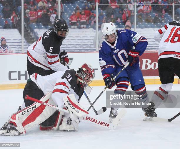 Will Lockwood of United States is stopped by Carter Hart of Canada in the first period during the IIHF World Junior Championship at New Era Field on...