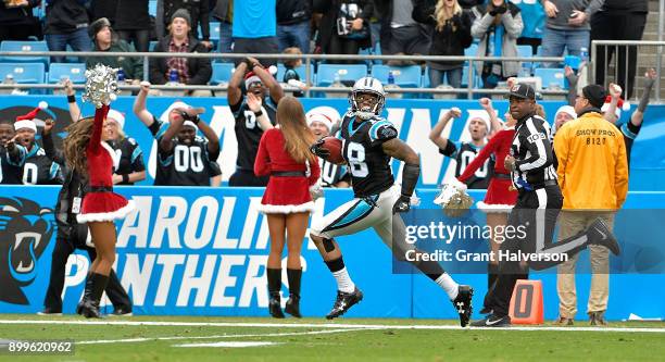 Damiere Byrd of the Carolina Panthers returns a kickoff for a touchdown against the Tampa Bay Buccaneers during their game at Bank of America Stadium...