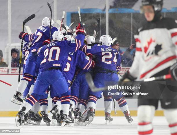 The United States team celebrates after beating Canada during the IIHF World Junior Championship at New Era Field on December 29, 2017 in Buffalo,...