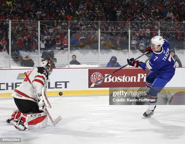 Brady Tkachuk of United States scores a goal against Carter Hart of Canada in the shootout against Canada during the IIHF World Junior Championship...