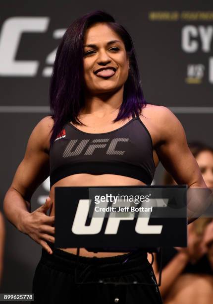 Cynthia Calvillo poses on the scale during the UFC 219 weigh-in inside T-Mobile Arena on December 29, 2017 in Las Vegas, Nevada.