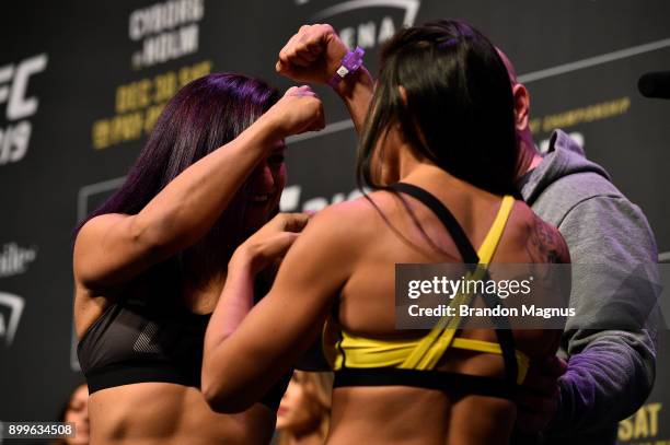 Cynthia Calvillo and Carla Esparza face off during the UFC 219 weigh-in inside T-Mobile Arena on December 29, 2017 in Las Vegas, Nevada.