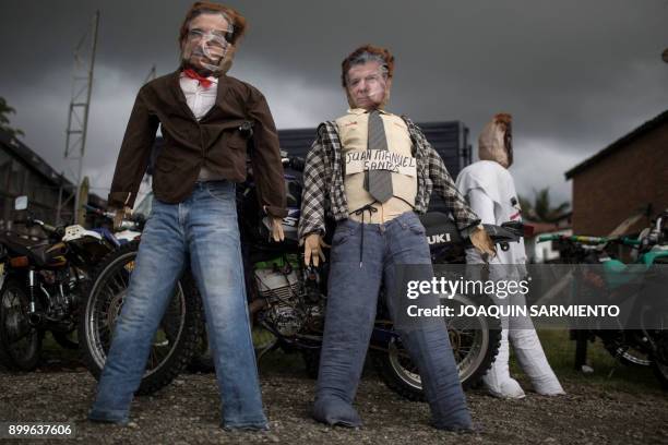 Old Year dolls" representing FARC leader Rodrigo Londono , aka Timochenko, and Colombian President Juan Manuel Santos are on display for sale in...