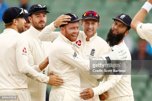 Jonny Bairstow of England celebrates after dismissing Shaun Marsh of Australia with Joe Root, Moeen Ali and his teammates during day one of the...