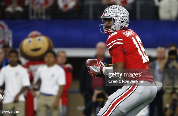 Barrett of the Ohio State Buckeyes looks to throw against the USC Trojans in the first half of the 82nd Goodyear Cotton Bowl Classic between USC and...