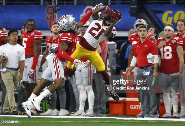 Tyler Vaughns of the USC Trojans catches a pass for a first down against Damon Arnette of the Ohio State Buckeyes in the first half of the 82nd...
