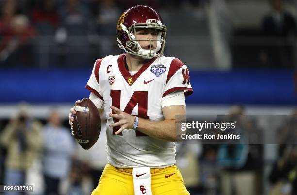 Sam Darnold of the USC Trojans looks to throw against the Ohio State Buckeyes in the first half of the 82nd Goodyear Cotton Bowl Classic between USC...