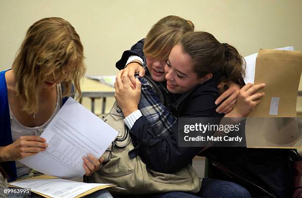 Pupils from Hayesfield Sixth Form celebrate as Lily Byham opens her results of three A grades at A-level on August 20, 2009 in Bath, United Kingdom....