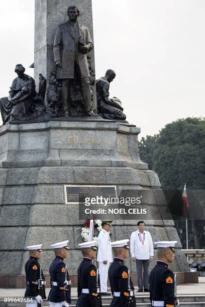 Philippines' President Rodrigo Duterte offers a wreath during the commemoration of the 121st death anniversary of the country's national hero Jose...