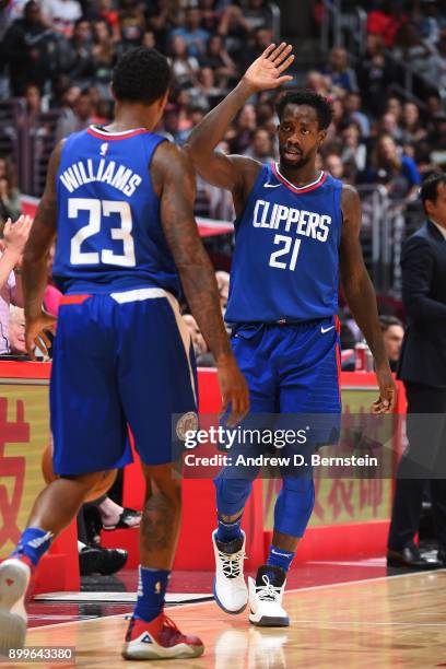 Patrick Beverley of the LA Clippers and Lou Williams of the LA Clippers high five during the game against the Miami Heat on November 5, 2017 at...