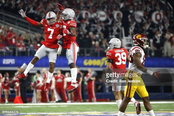 Damon Webb and Jerome Baker of the Ohio State Buckeyes celebrate after Baker recovered a fumble in the first half of the 82nd Goodyear Cotton Bowl...