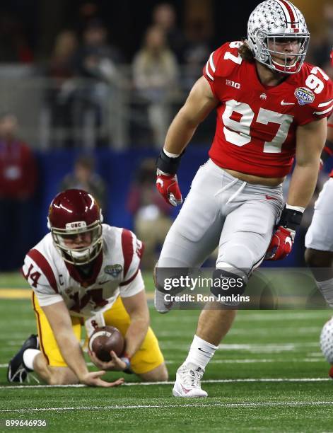 Nick Bosa of the Ohio State Buckeyes reacts after sacking Sam Darnold of the USC Trojans in the first half of the 82nd Goodyear Cotton Bowl Classic...