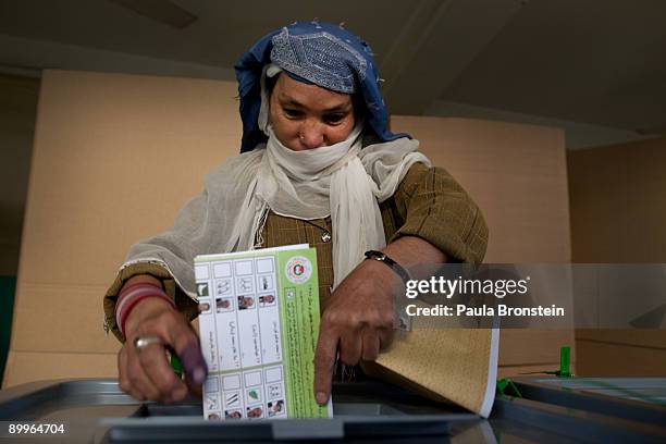 An Afghan votes at a local mosque used as a polling station August 20, 2009 in Kabul, Afghanistan. Afghans voted Thursday to elect a president for...