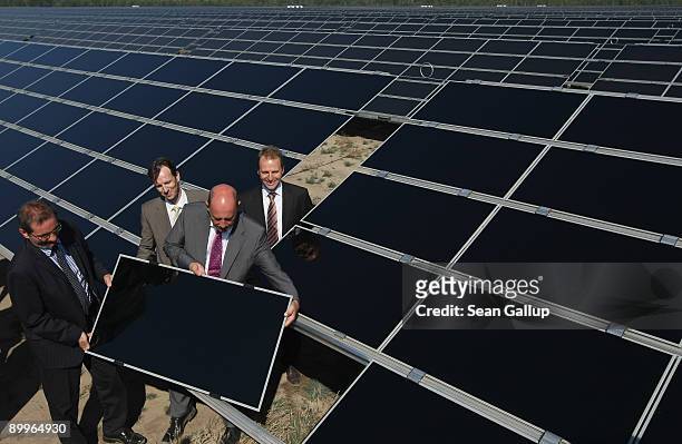 German Transport Minister Wolfgang Tiefensee and Brandenburg Governor Matthias Platzeck symbolically install a solar panel at the inauguration of the...