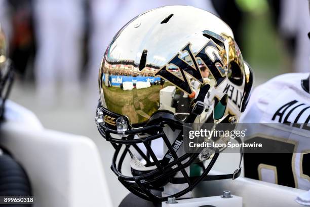 Wake Forest Demon Deacons helmet is warmed on an air vent on the bench during the Belk Bowl between the Wake Forest Demon Deacons and the Texas A&M...