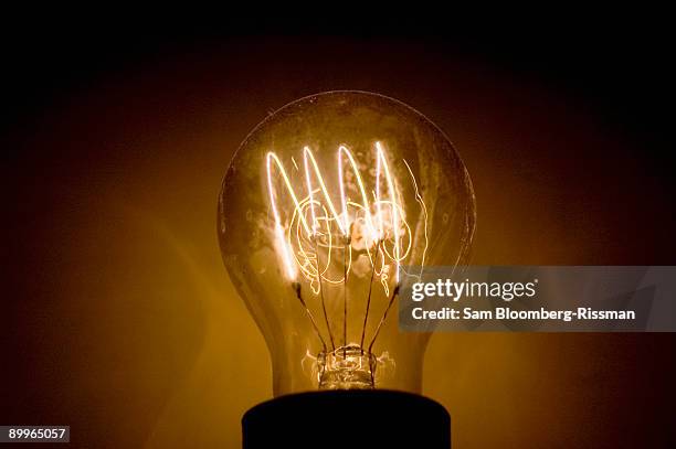 lightbulb - incandescent bulb stock pictures, royalty-free photos & images
