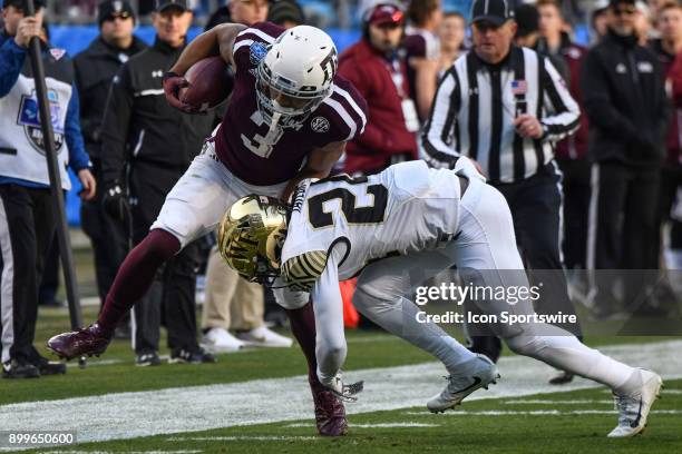 Texas A&M Aggies wide receiver Christian Kirk is hit near the sideline by Wake Forest Demon Deacons defensive back Ja'Sir Taylor during the Belk Bowl...