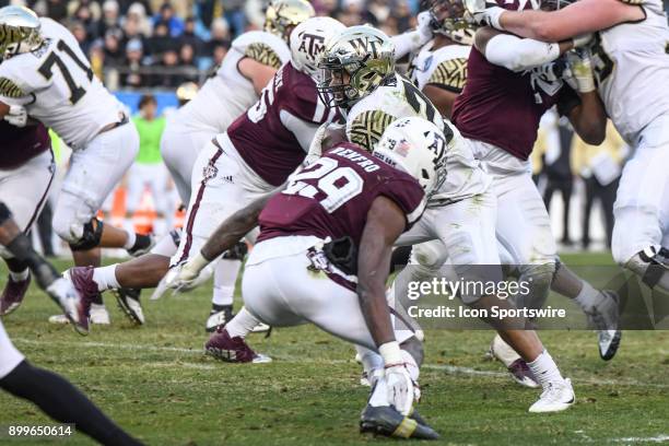 Wake Forest Demon Deacons running back Matt Colburn runs the ball in traffic during the Belk Bowl between the Wake Forest Demon Deacons and the Texas...