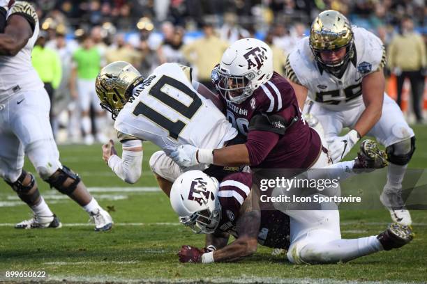 Wake Forest Demon Deacons quarterback John Wolford is tackled short of the end zone on a run during the Belk Bowl between the Wake Forest Demon...