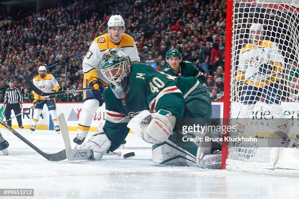 Devan Dubnyk of the Minnesota Wild makes a save against the Nashville Predators during the game at the Xcel Energy Center on December 29, 2017 in St....