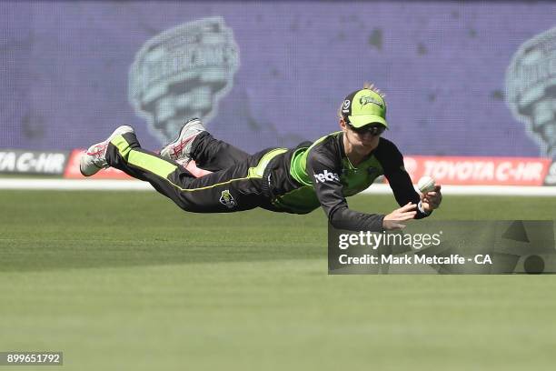 Rachel Haynes of the Thunder takes a catch to dismiss Corinne Hall of the Hurricanes during the Women's Big Bash League match between the Hobart...