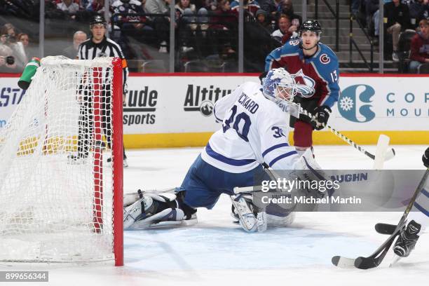 Alexander Kerfoot of the Colorado Avalanche scores against goaltender Calvin Pickard of the Toronto Maple Leafs at the Pepsi Center on December 29,...
