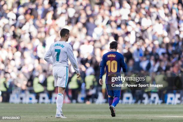 Lionel Messi of FC Barcelona and Cristiano Ronaldo of Real Madrid walk off pitch during La Liga match between Real Madrid and FC Barcelona at...