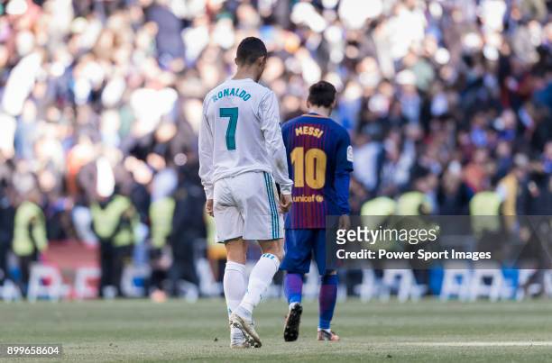 Lionel Messi of FC Barcelona and Cristiano Ronaldo of Real Madrid walk off pitch during La Liga match between Real Madrid and FC Barcelona at...