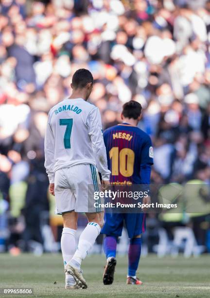 Lionel Messi of FC Barcelona and Cristiano Ronaldo of Real Madrid walk off pitch during La Liga match between Real Madrid and FC Barcelona at...