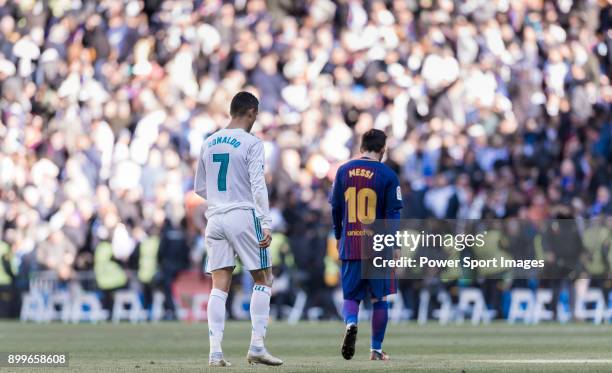 Lionel Messi of FC Barcelona and Cristiano Ronaldo of Real Madrid walk off pitch during La Liga match between Real Madrid and FC Barcelona at...