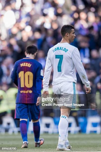 Lionel Messi of FC Barcelona and Cristiano Ronaldo of Real Madrid walk off pitch during La Liga match between Real Madrid and FC Barcelona at...