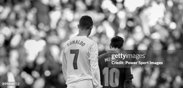 Lionel Messi of FC Barcelona and Cristiano Ronaldo of Real Madrid walk off pitch during La Liga match between Real Madrid and FC Barcelona at...