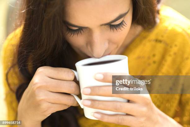 woman drinking coffee - black coffee stock pictures, royalty-free photos & images