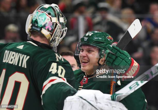 Minnesota Wild Right Wing Mikael Granlund and Minnesota Wild Goalie Devan Dubnyk celebrate a Wild win after a NHL game between the Minnesota Wild and...