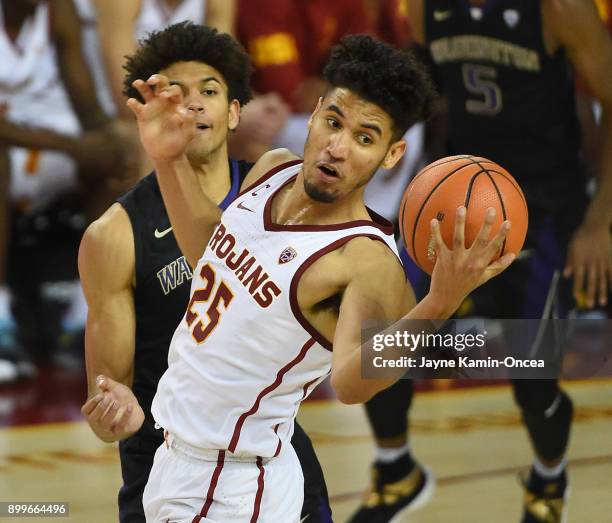 Matisse Thybulle of the Washington Huskies guards Bennie Boatwright of the USC Trojans in the second half of the game at Galen Center on December 29,...