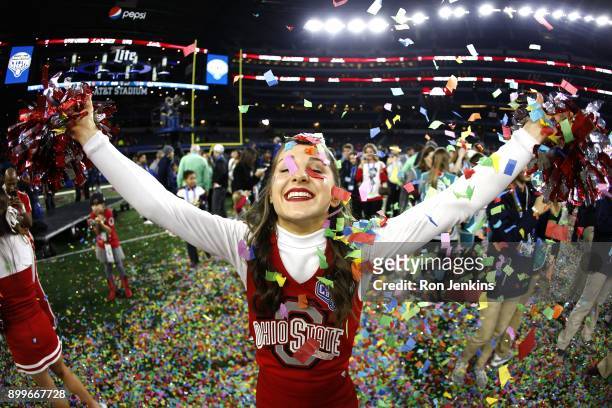 An Ohio State cheerleader celebrates following the 82nd Goodyear Cotton Bowl Classic between USC and Ohio State at AT&T Stadium on December 29, 2017...