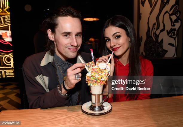 Singer-songwriter/actor Reeve Carney and actress Victoria Justice attend the grand opening of Black Tap Craft Burgers & Beer at The Venetian Las...