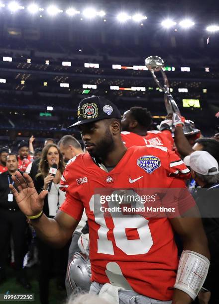 Barrett of the Ohio State Buckeyes celebrates after winning the Goodyear Cotton Bowl against the USC Trojans at AT&T Stadium on December 29, 2017 in...