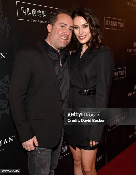 Co-owner Chris Barish and and his wife Julie Mulligan attend the grand opening of Black Tap Craft Burgers & Beer at The Venetian Las Vegas on...