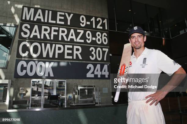 Alastair Cook of England poses next to his score of 244 not out made in the Percy Beams bar after the drawn result during day one of the Fourth Test...