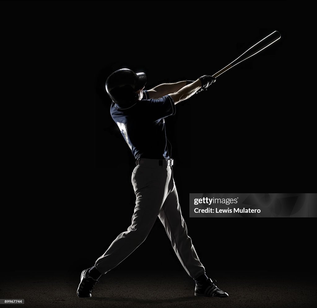 Baseball player swinging bat