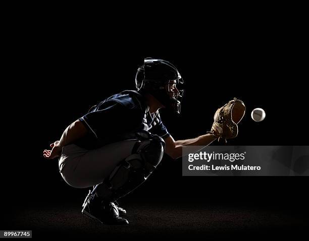 baseball catcher catching ball in mitt - baseball glove stock pictures, royalty-free photos & images