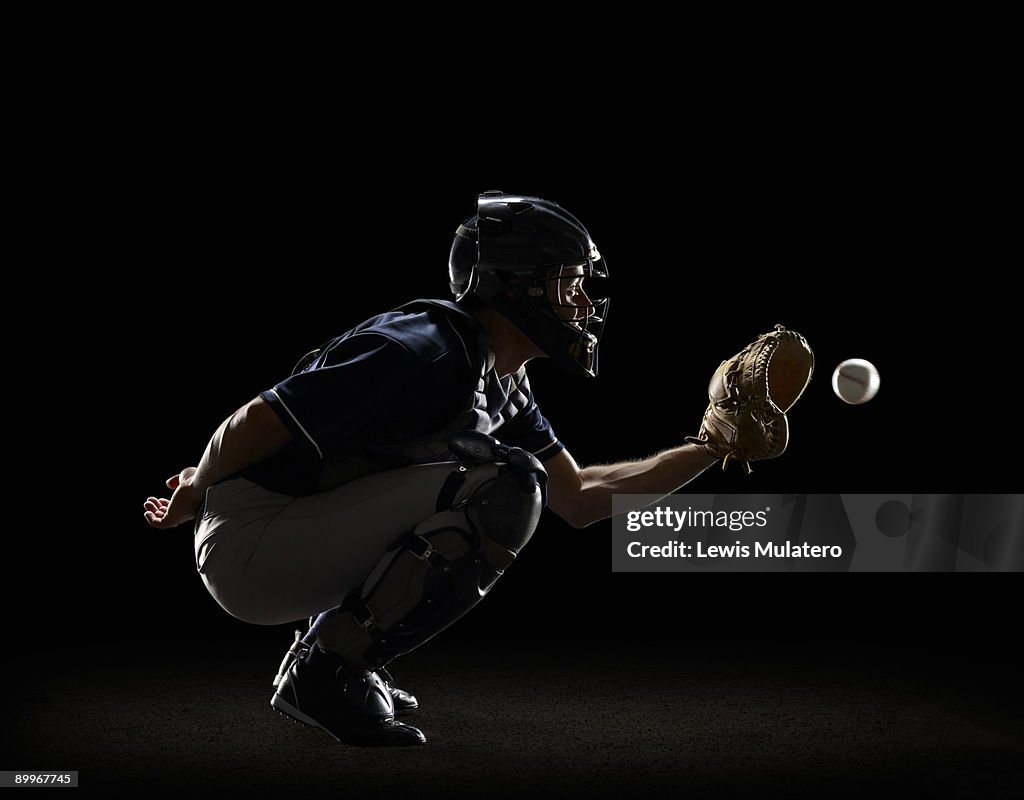 Baseball Catcher catching ball in mitt