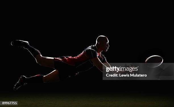 rugby player making a diving pass of the ball - diving to the ground bildbanksfoton och bilder