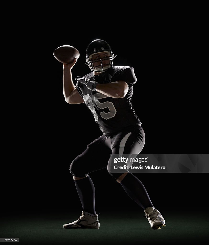 Quarterback preparing to throw football