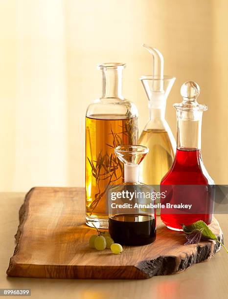 assorted vinegars - vinegar stockfoto's en -beelden