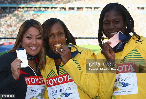 Priscilla Lopes-Schliep of Canada receives the silver medal, Brigitte Foster-Hylton of Jamaica the gold medal and Delloreen Ennis-London of Jamaica...