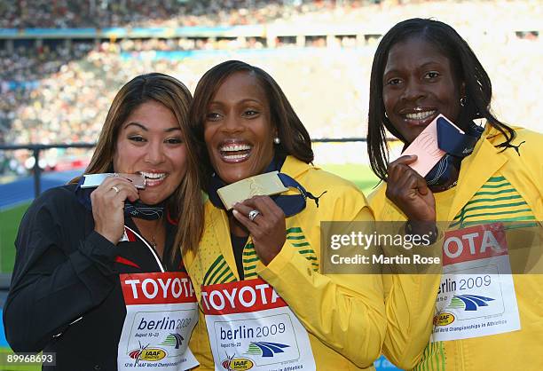 Priscilla Lopes-Schliep of Canada receives the silver medal, Brigitte Foster-Hylton of Jamaica the gold medal and Delloreen Ennis-London of Jamaica...